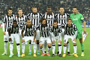 TURIN, ITALY - NOVEMBER 04: Team of Juventus line up prior to the UEFA Champions League group A match between Juventus and Olympiacos FC at Juventus Arena on November 4, 2014 in Turin, Italy. (Photo by Valerio Pennicino/Getty Images)